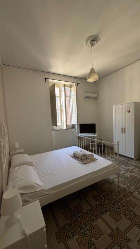 a bedroom with a large bed in a room at Sunset hostel Palermo in Palermo