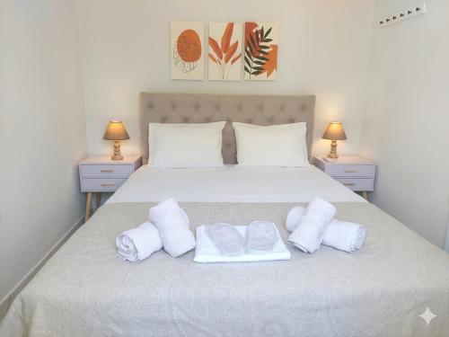 a bedroom with a bed with towels on it at Electra Gaios Apartment in Gaios