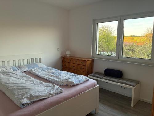 a bedroom with two beds and a window at Hedwig und Anna in Zapfendorf