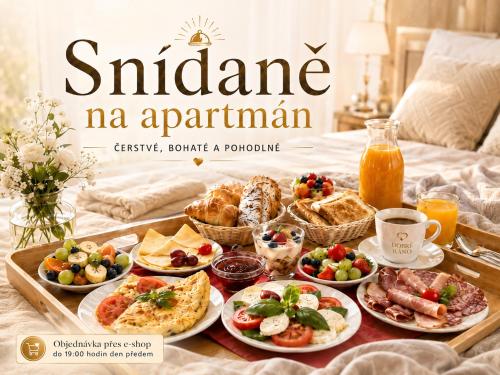 a tray of food on a bed with food on it at Apartment Katrin Harrachov Resident - Sauna world free in Harrachov