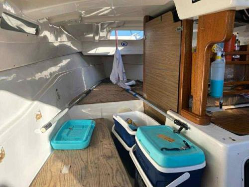a small boat with two trays in the back of it at Yacht for rent in Bacalar in Bacalar