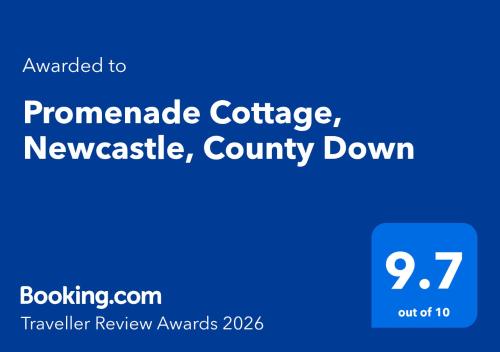 a blue sign with the words promoteateateateateateateawarawarawar at Promenade Cottage, Newcastle, County Down in Widows Row