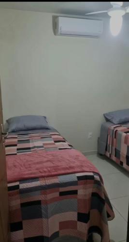 a bedroom with two beds in a room at Intermares perto de tudo com 3 quartos in Cabedelo