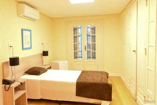 Ένα ή περισσότερα κρεβάτια σε δωμάτιο στο Hotel Praça da Matriz