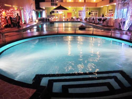 a large swimming pool in a hotel lobby at Seascape Hotel in Dar es Salaam