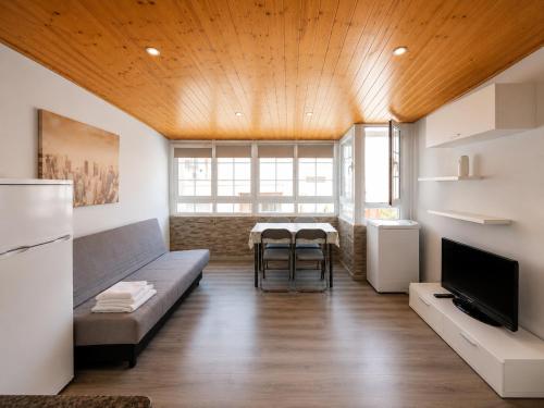 a living room with a couch and a table at AMAIKA AH Rentals in Peniscola