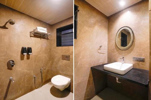a bathroom with a toilet and a sink and a mirror at FabHotel Prasad International in Mumbai
