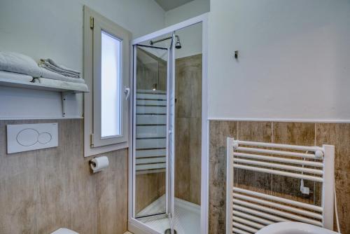 a bathroom with a shower and a toilet at Hotel Everest - Bar e Ristorante in Gabicce Mare