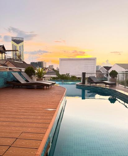 a swimming pool on the roof of a building at SALA HOTEL HUE in Hue