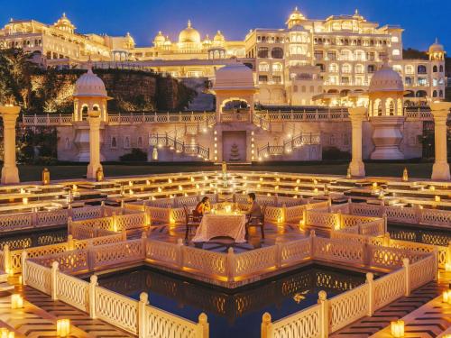 a view of the jaipur palace at night at Fairmont Udaipur Palace in Udaipur