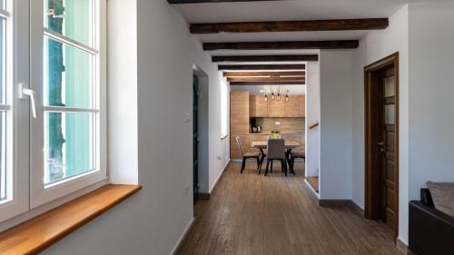 a hallway leading to a dining room with a window at Villa Maslina in Novalja