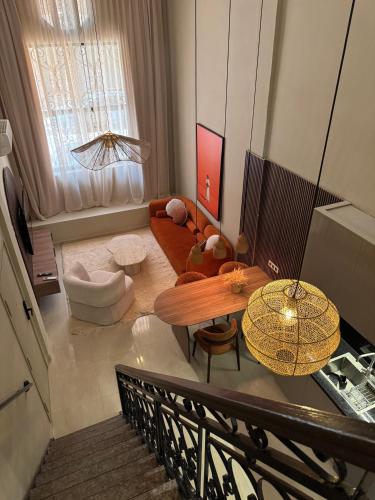 a living room with a couch and a table at GUELIZ Seven Stays in Marrakesh