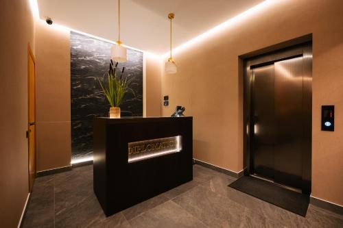 a elevator lobby with a welcome sign on the wall at Diplomatico Hotel in Odesa