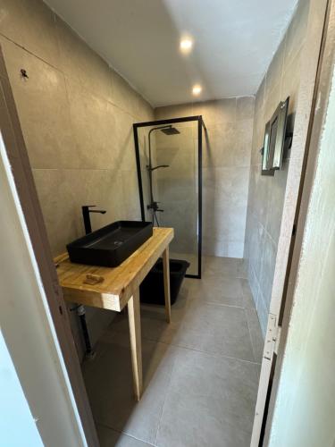 a bathroom with a sink and a shower at Toubakouta River Paradise in Toubakouta