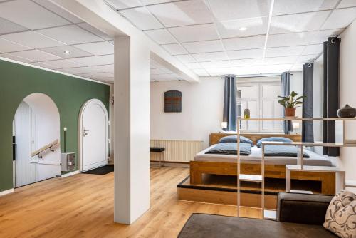 a bedroom with a bed and a living room at Ferien- und Handwerkerwohnung in Römhild
