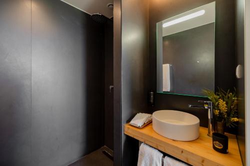 a bathroom with a sink and a mirror at Casas da Quinta de Santa Cruz - Douro Land in Peso da Régua