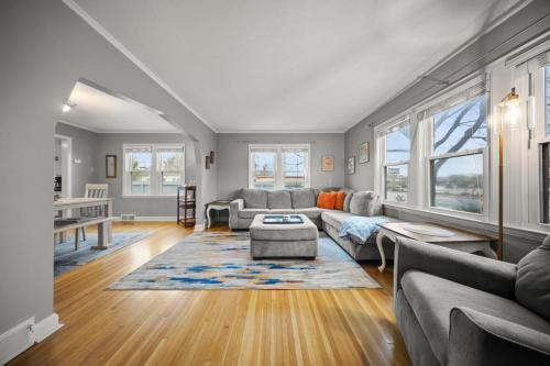 a living room with a couch and a table at Main Street Suite in Anoka