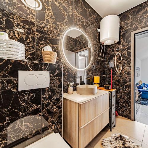 a bathroom with a sink and a mirror at Villa Love house in Vela Luka