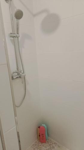 a shower in a bathroom with a shower head at Casa Rochafrida in Ossa de Montiel