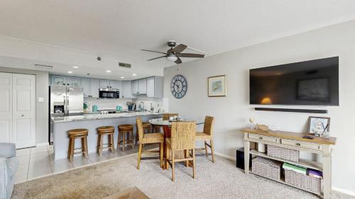 a kitchen and dining room with a table and chairs at Ocean Block retreat with easy beach access & shared pools in Ocean City