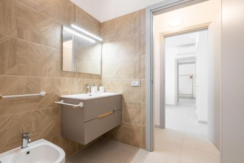 a bathroom with a sink and a toilet at Domus Alba in Teulada