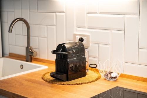 a coffee maker sitting on a counter in a kitchen at Domus Luxi in Teulada