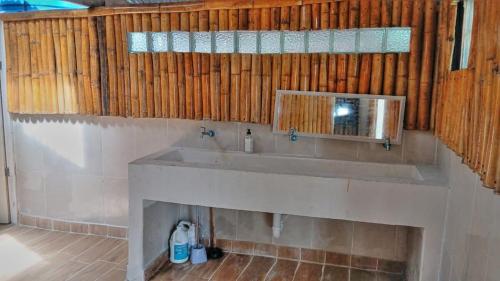 a bathroom with a sink and a mirror at Islas de San blas Glamping in Tubusinica