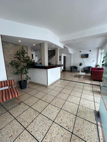 a living room with a tile floor and a counter at Hanna in Mar del Plata