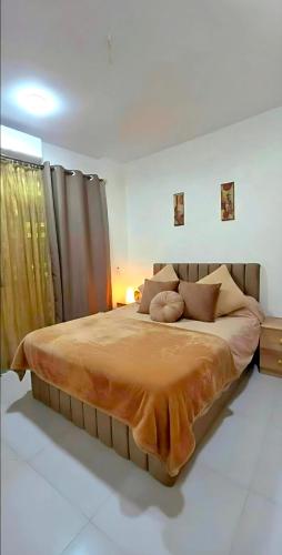 a bedroom with a large bed in a room at Solara in Hurghada