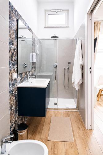 a bathroom with a sink and a shower at Fuoribinario B&B in San Felice a Cancello