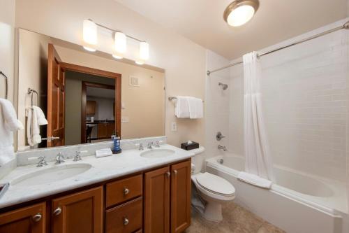 a bathroom with a sink and a toilet and a tub at WorldMark Blaine in Birch Bay