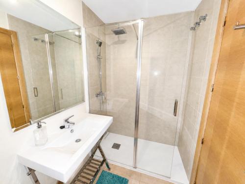 a bathroom with a sink and a shower at Condado de Alhama la isla 7SV2D in El Romero