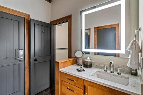 a bathroom with a sink and a mirror at Sunriver Resort in Sunriver