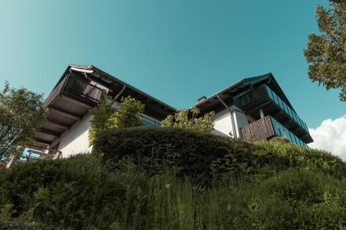 a building with two balconies on top of a hill at Harz BnB Werkmeister in Sankt Andreasberg