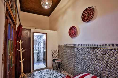 a bathroom with a mirror on the wall at Riad Zayna Fes in Fez