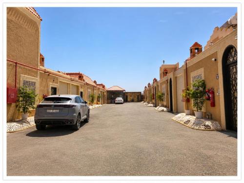 a car parked in the middle of a street at شاليهات الفيه in Khamis Mushayt