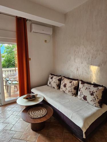 a living room with a couch and a table at Apartments Popovic 2 in Kotor