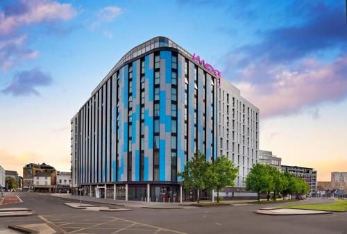 a rendering of a tall building in a city at Moxy Slough in Slough