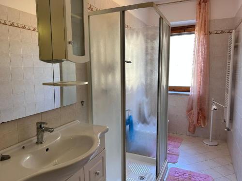 a bathroom with a sink and a shower at Villa Vanessa in Spoltore