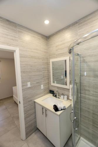 a bathroom with a sink and a shower at 246D South Finger in Jolly Harbour