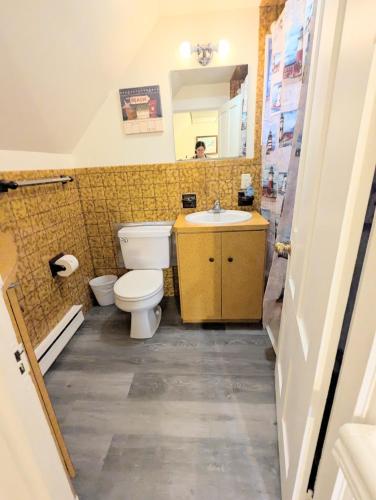 a bathroom with a toilet and a sink at 1 central ave in Old Orchard Beach