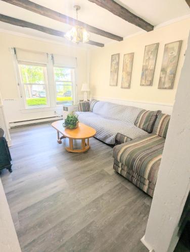 a living room with a couch and a table at 1 central ave in Old Orchard Beach