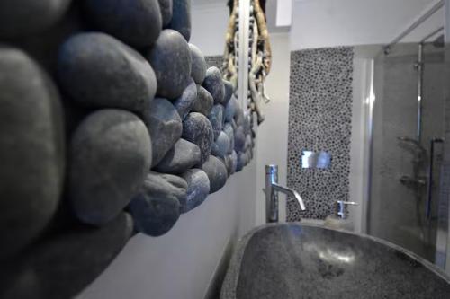 a bathroom with a sink and a mirror at Harmony Villa in Karpathos