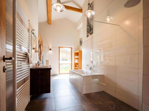 a large bathroom with a sink and a shower at Zattach 57 in Lake Pressegg