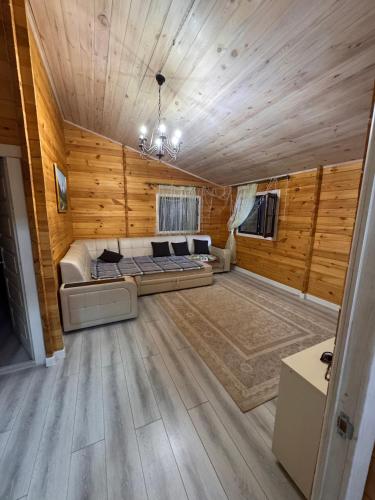 a large living room with a bed in the middle at Issyk-kul home in Korumdy