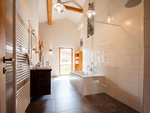 a bathroom with a sink and a mirror at Buchen 54 in Lake Pressegg