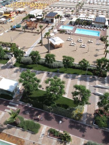 an aerial view of a park with chairs and a pool at Hotel Maestrale in Riccione