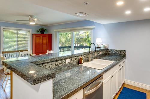 a kitchen with a sink and a counter top at Pool Access! Private Island Condo in Placida in Placida