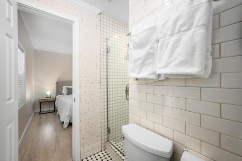 a bathroom with a toilet and a shower at 1628 West Oceanfront Oasis 6 in Newport Beach
