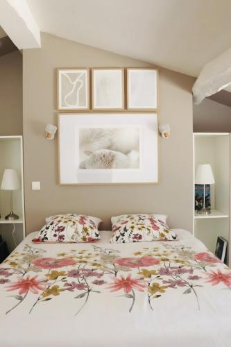 a bedroom with a bed with two pillows at Gite La Saintonge in Sainte-Gemme